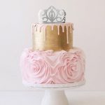 crown cake topper on gold cake